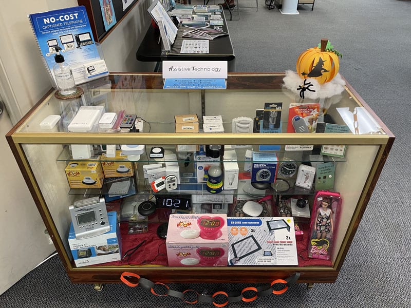 Photo: Display case with assistive technology devices at the CSC