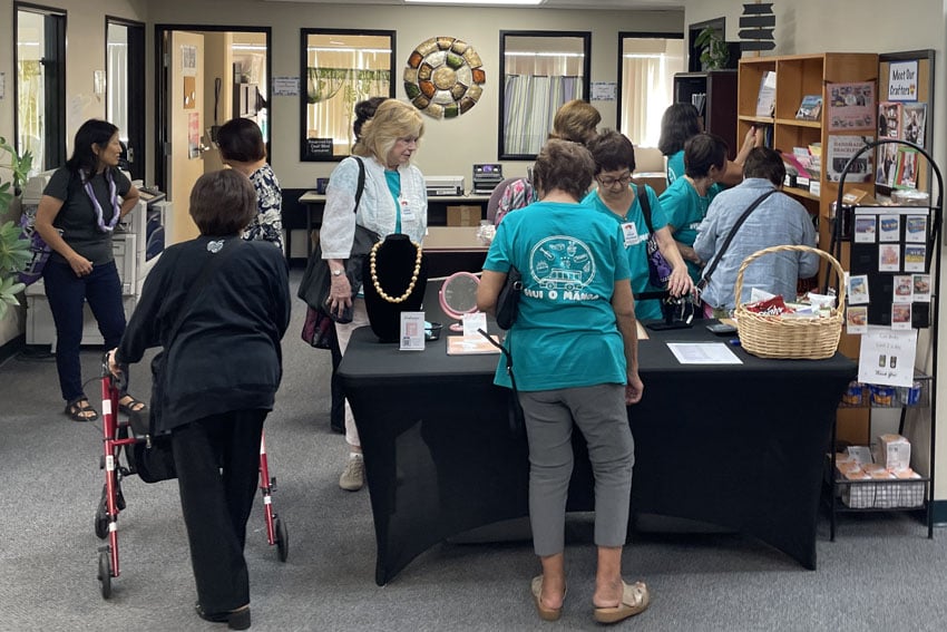 Photo: Seniors check out items at the CSC handmade store