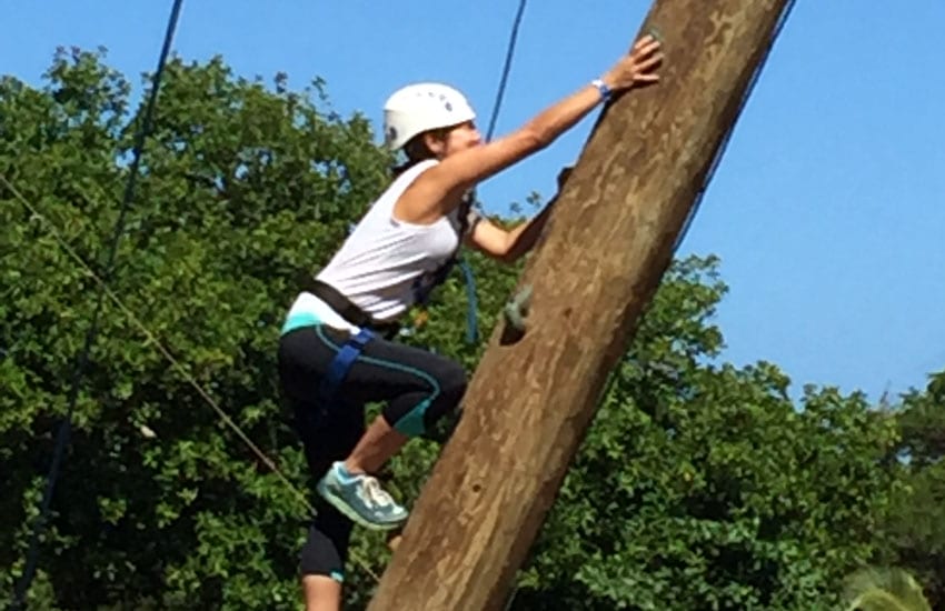 Photo: Camp participant on the climbing tower