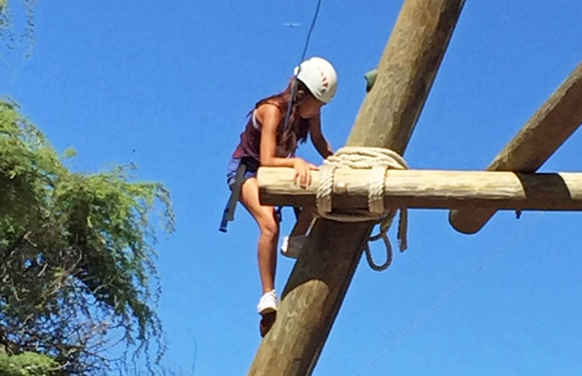 Photo: Camp participant on the climbing tower