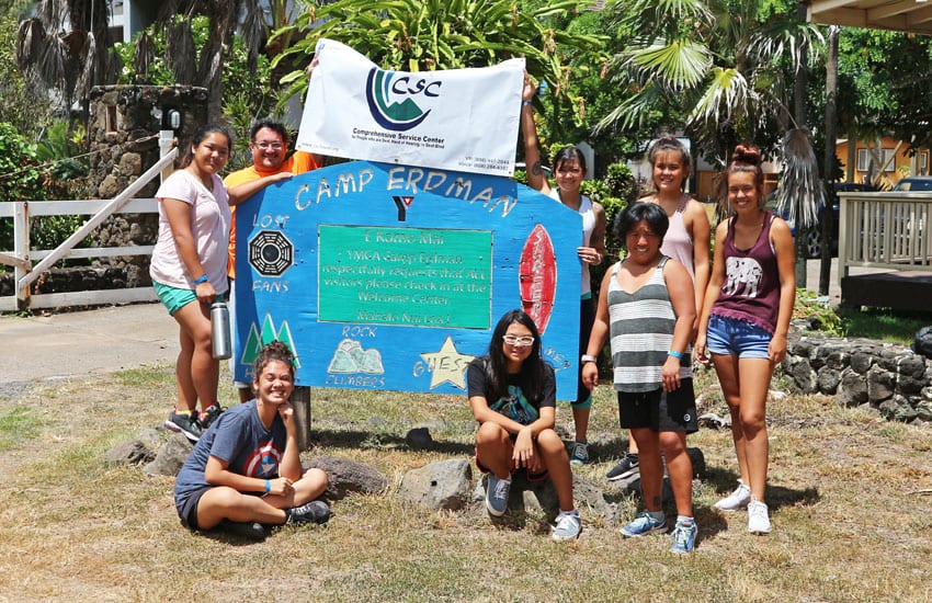 Photo: Camp counselors and participants with the Camp Erdman sign